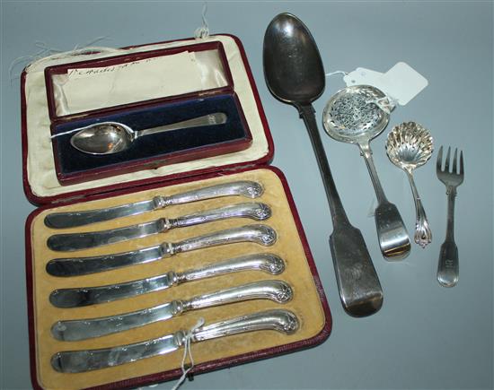 Victorian silver basting spoon, 6 silver butter knives (cased), a Christening spoon (cased), two other spoons & a fork